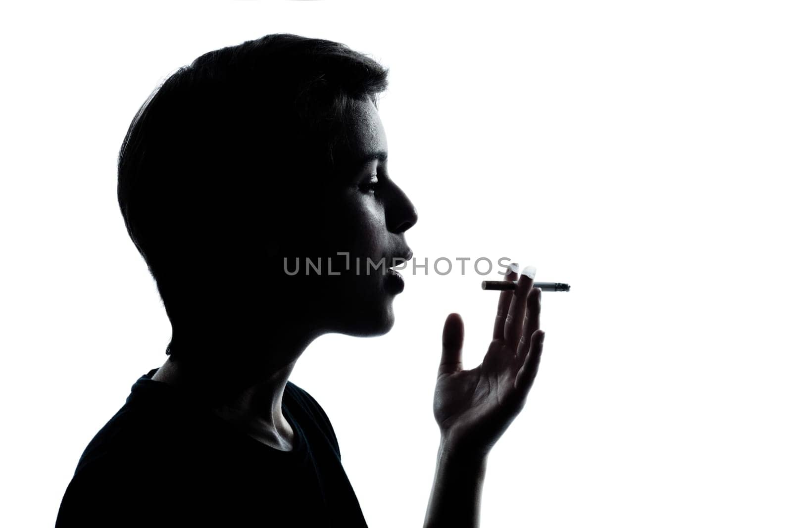 one caucasian young teenager silhouette boy or girl portrait in studio cut out isolated on white background