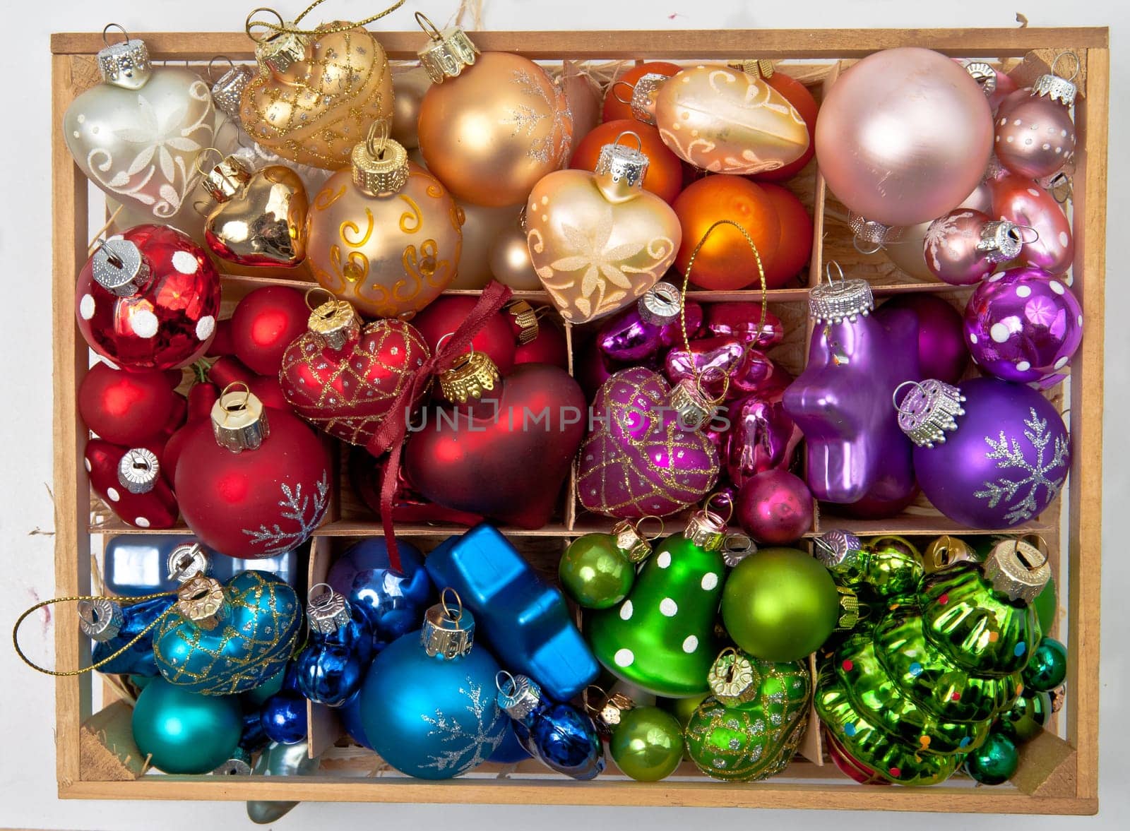Small box with colorful Christmas tree baubles for Christmas