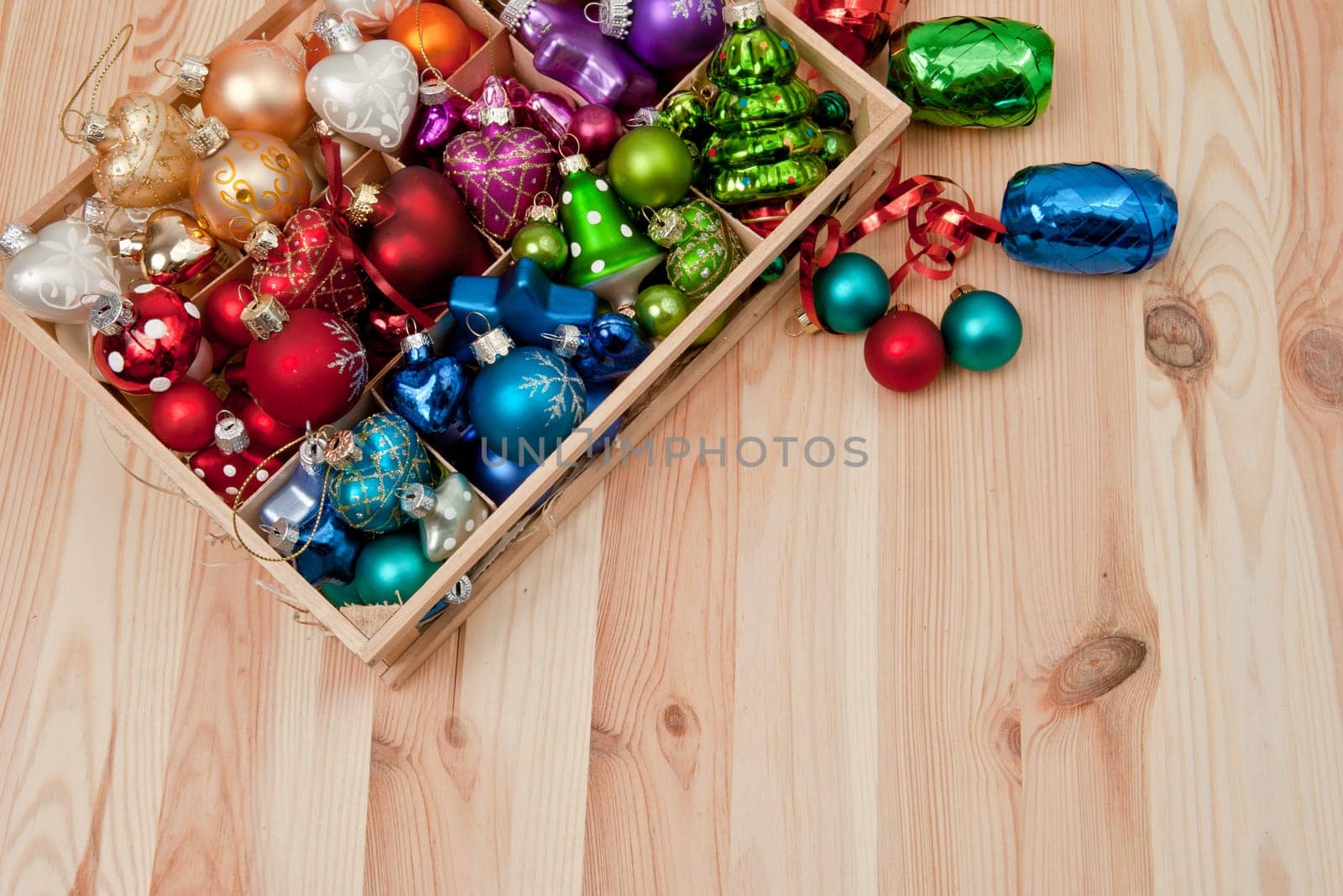 Small box with colorful Christmas tree baubles for Christmas