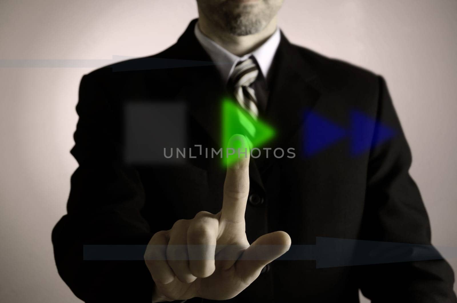 Business man pushing a green play button