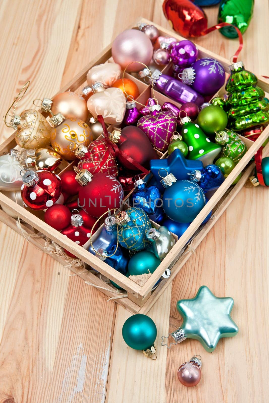 Small box with colorful Christmas tree baubles for Christmas