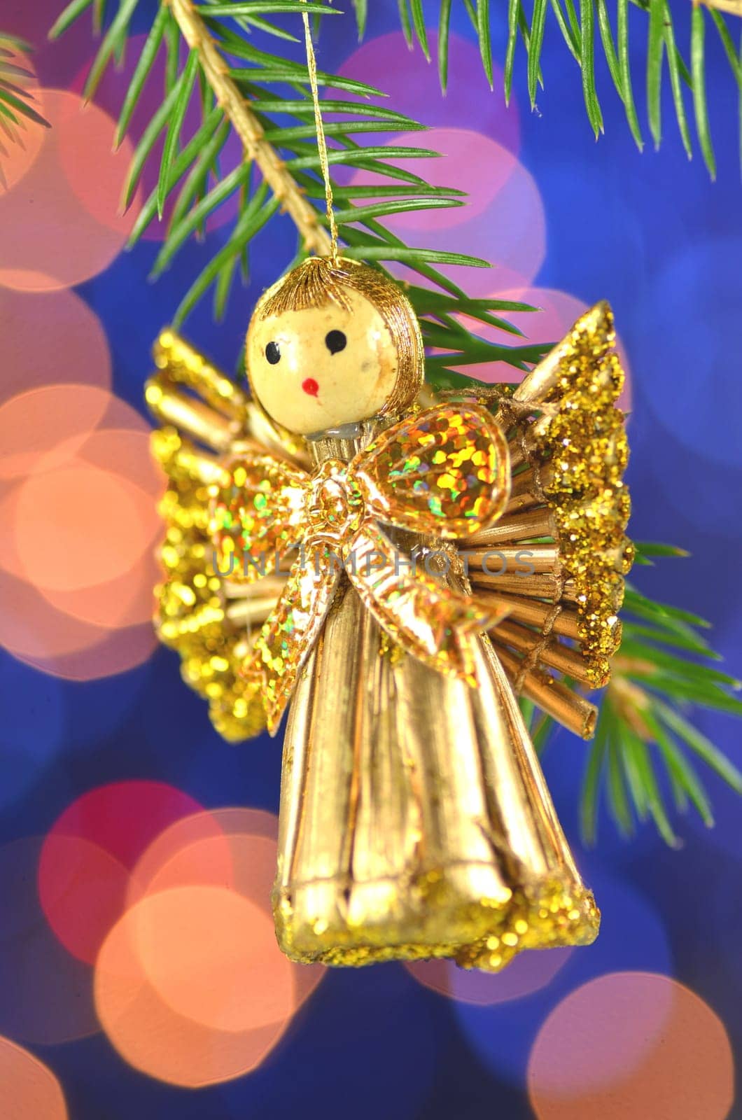 christmas decoration, angel made of straw and bokeh background