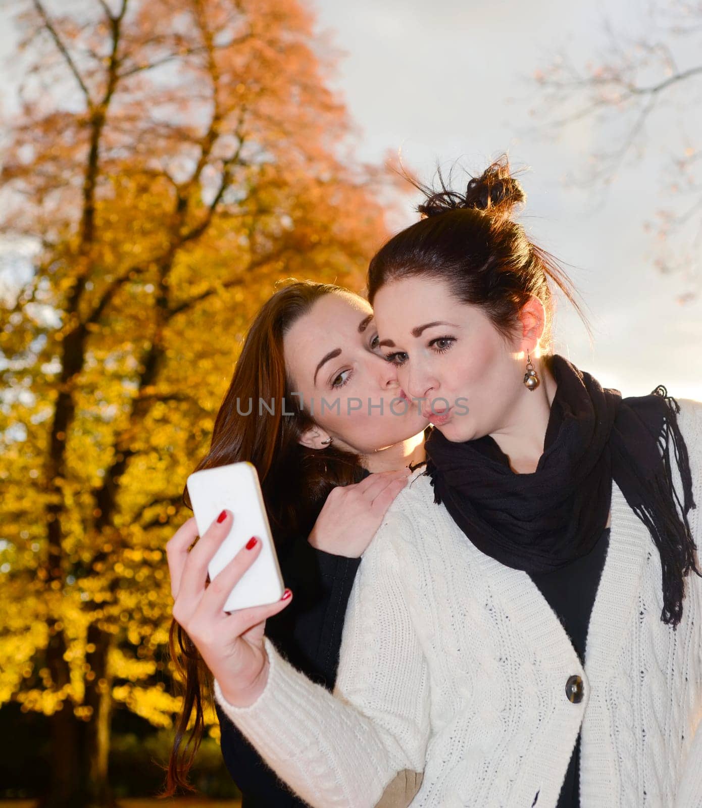 Girlfriends with smartphones
