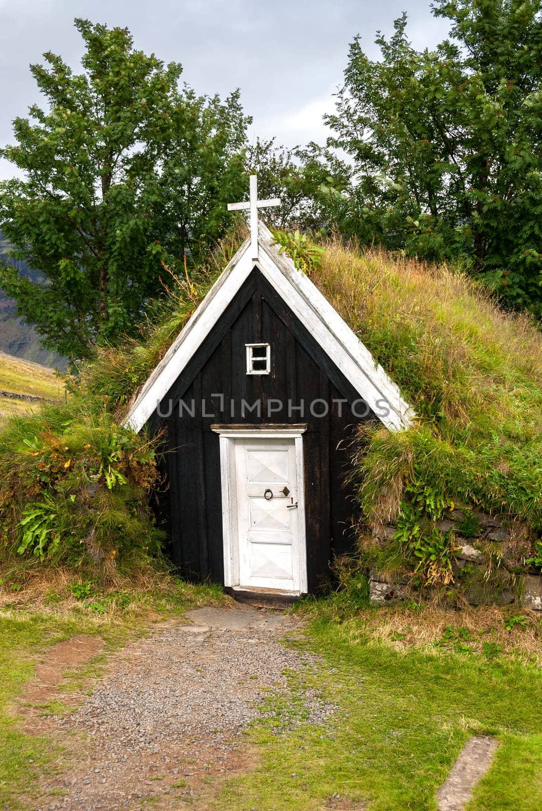 small church with a roof covered with grass in Iceland
