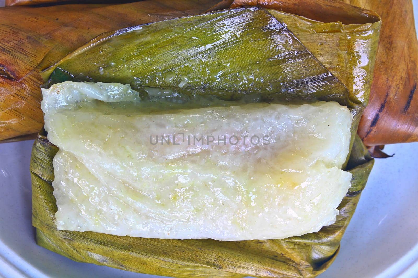 Thai style dessert, made from banana and glutinous rice, wrap with banana leaf