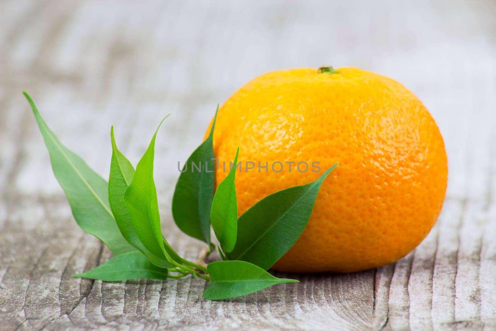 fresh tangerine on old wooden background