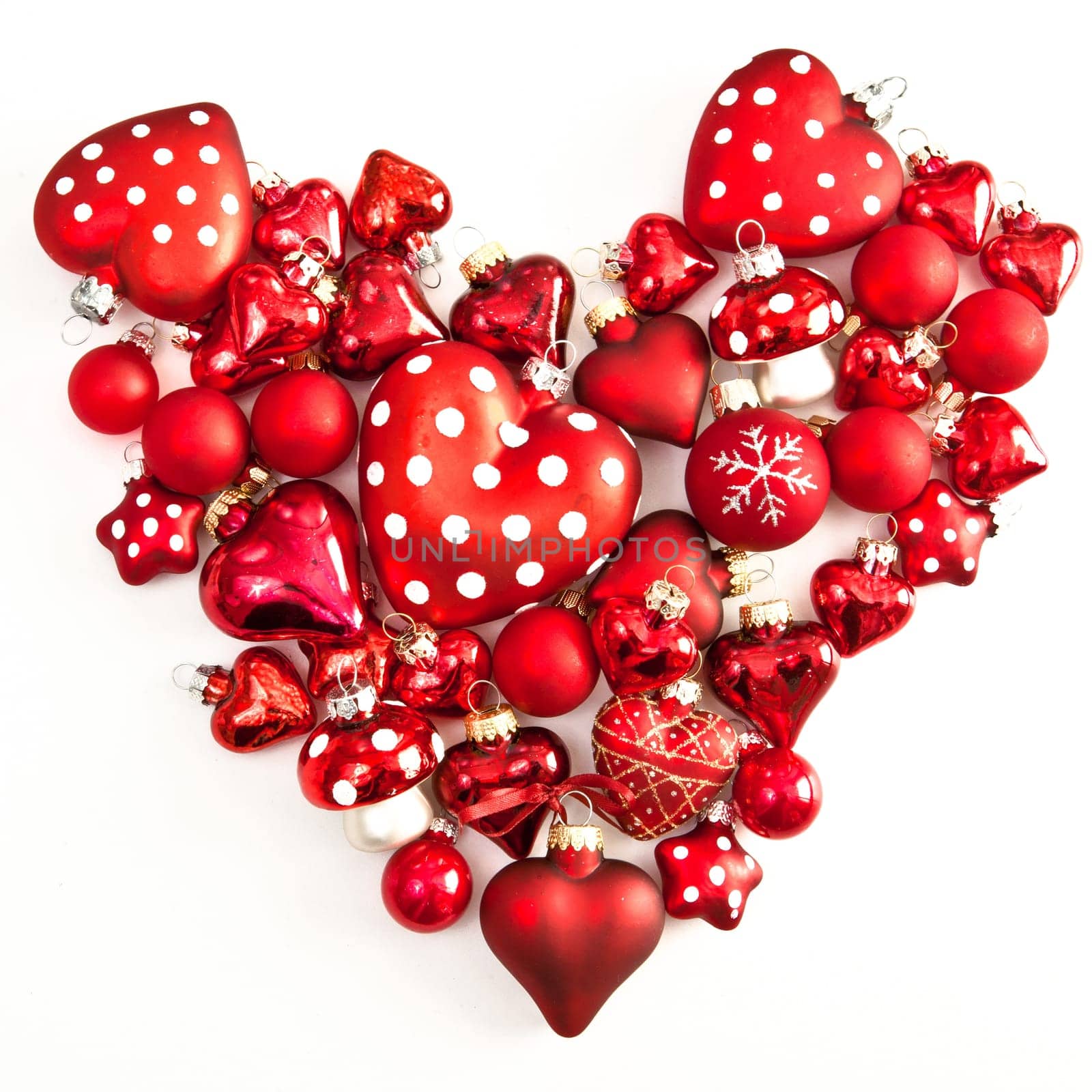 Red Christmas decoration in heart shape on white