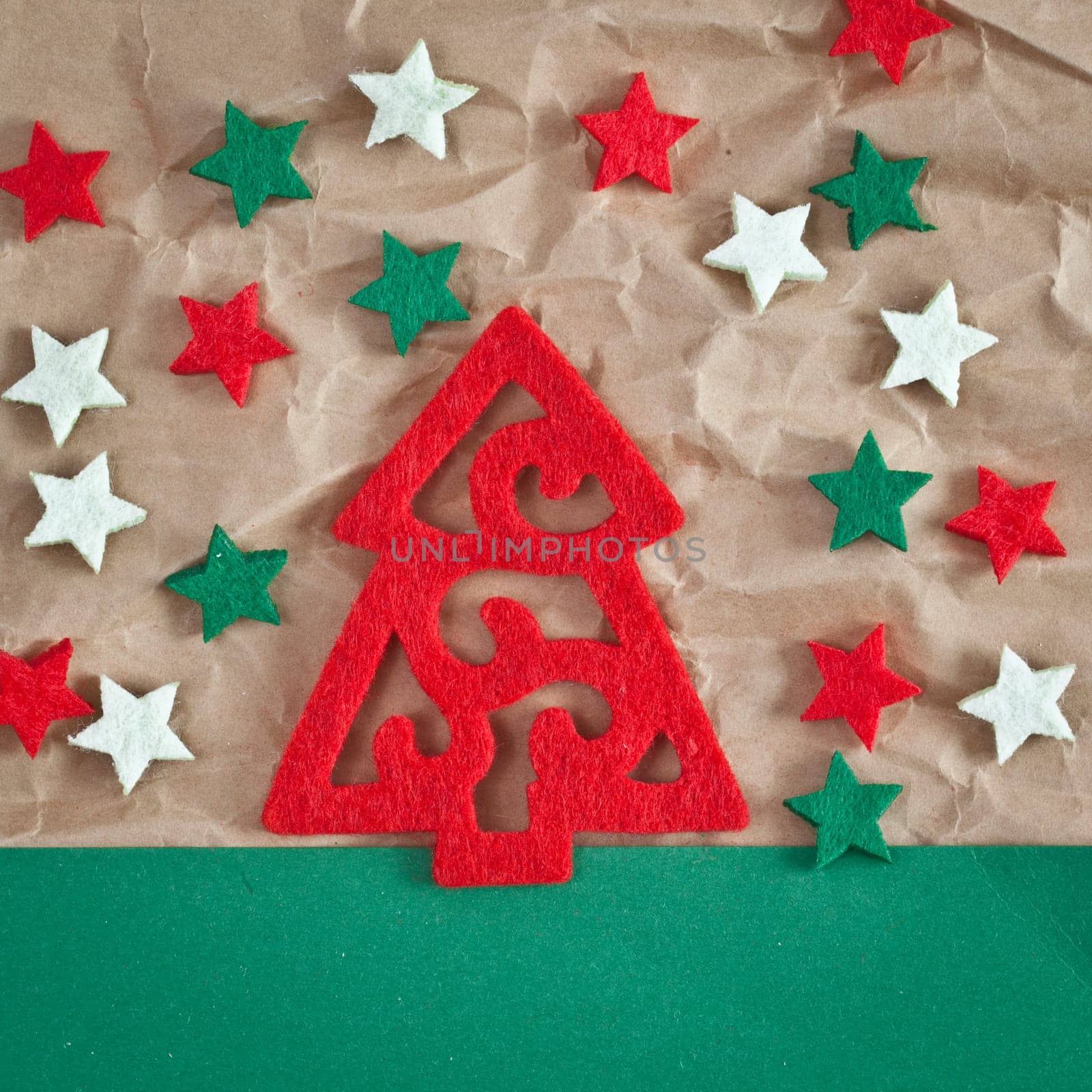 Red fir tree and colorful stars on paper