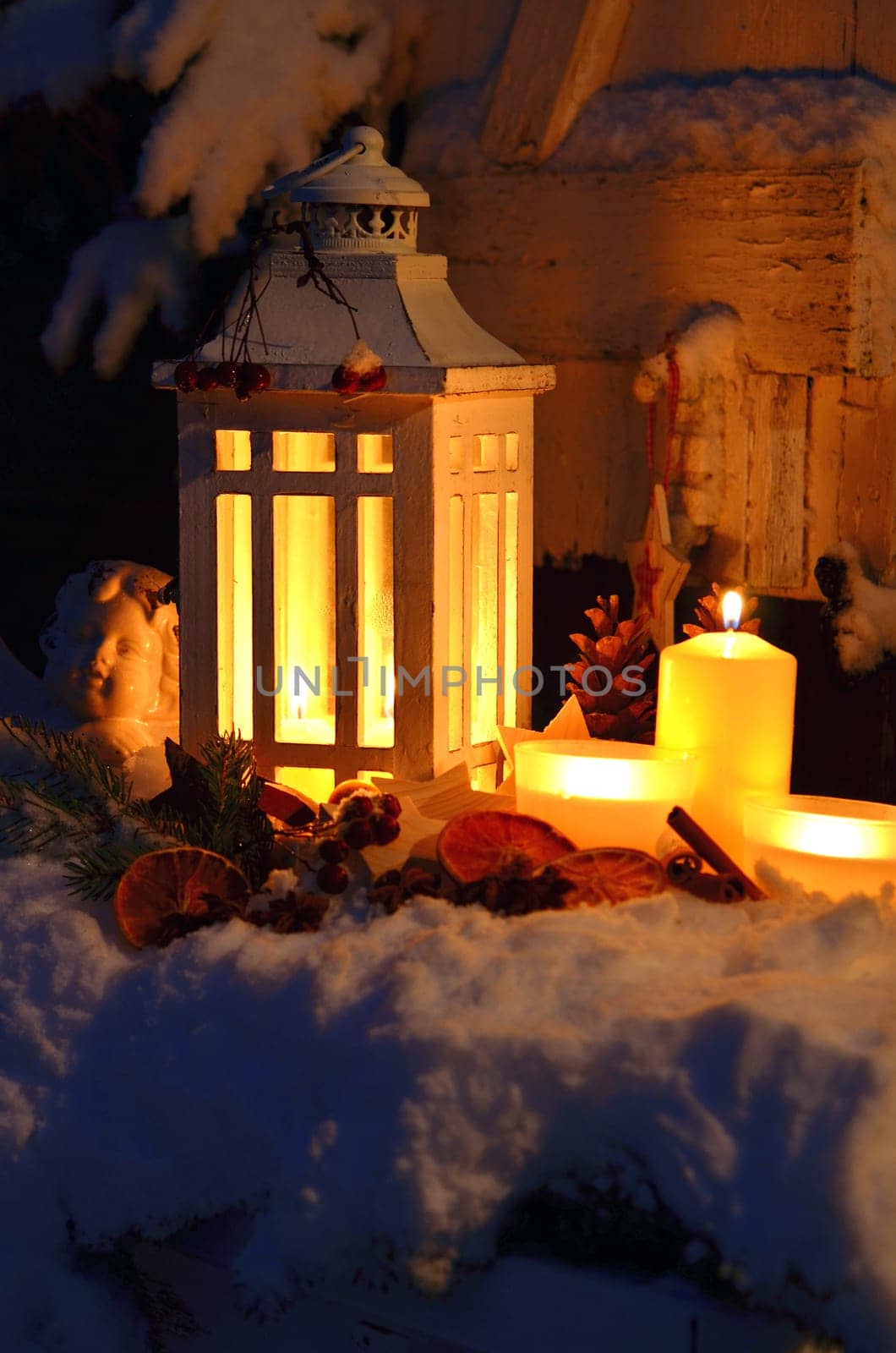Lantern in the snow contemplative Christmas candlelight