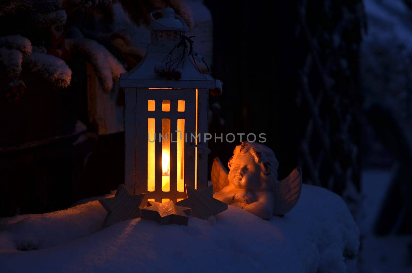 Lantern in the snow contemplative Christmas candlelight