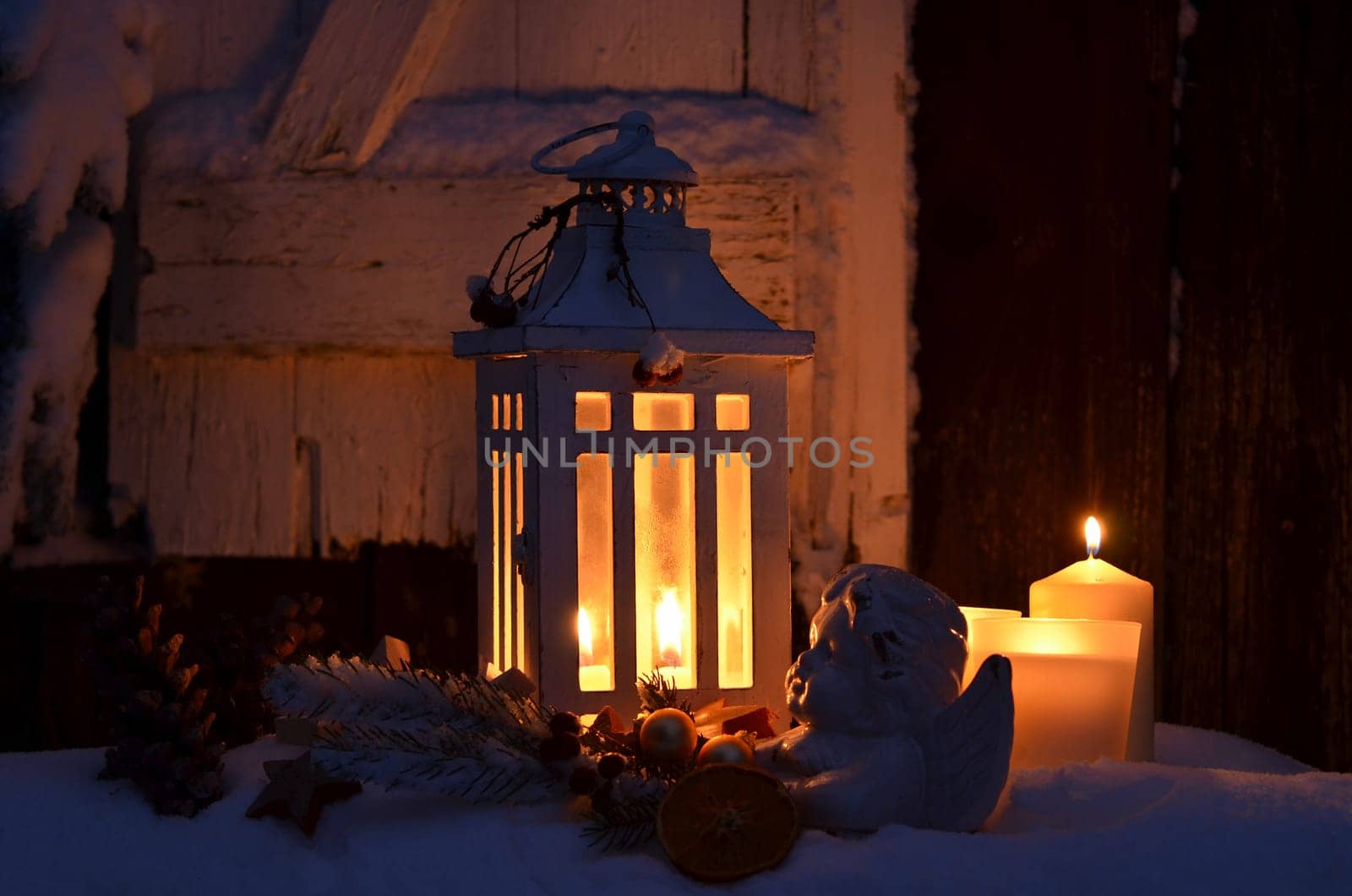 Lantern in the snow contemplative Christmas candlelight