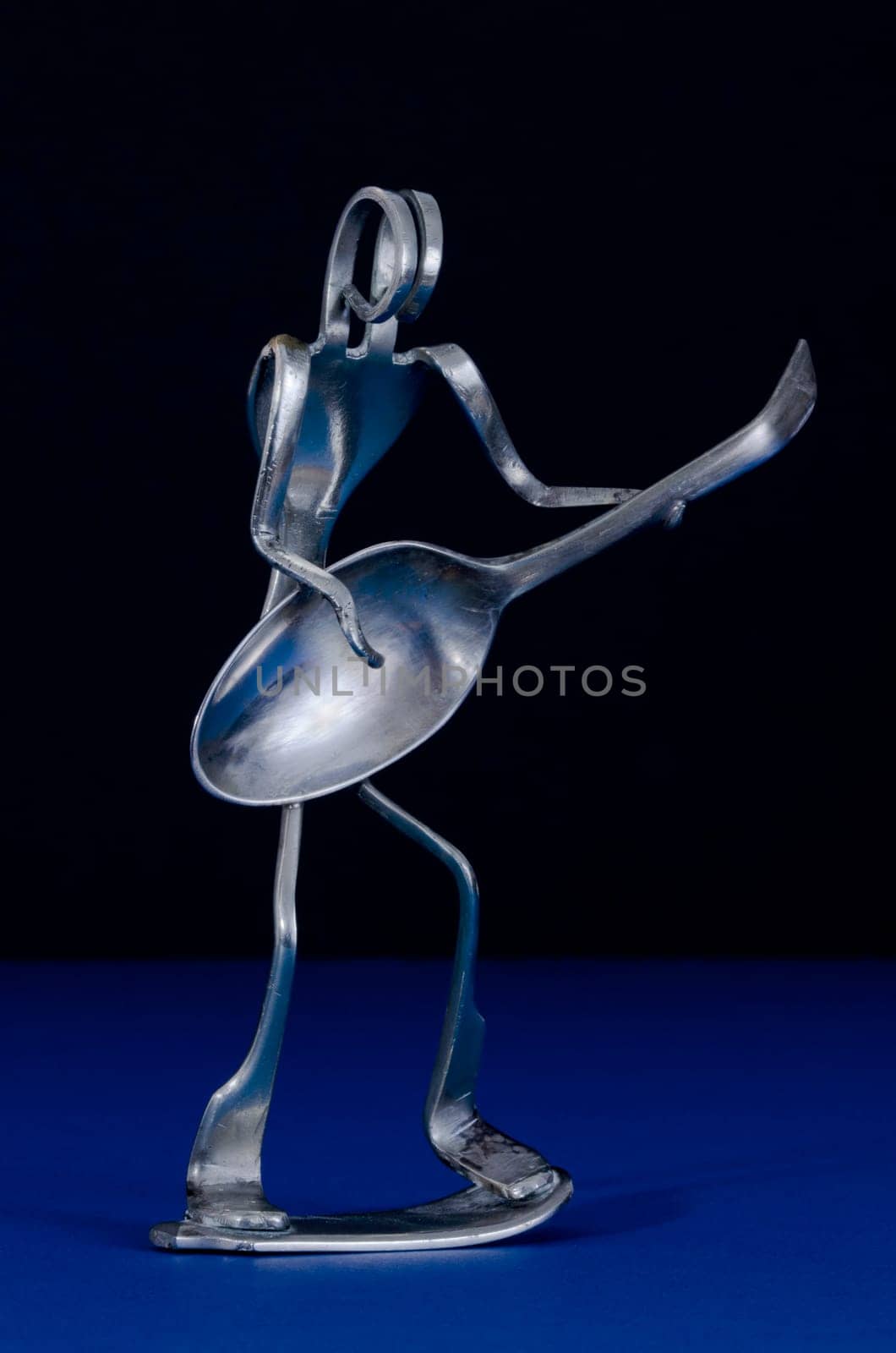 Silver fork and spoon model of guitarist