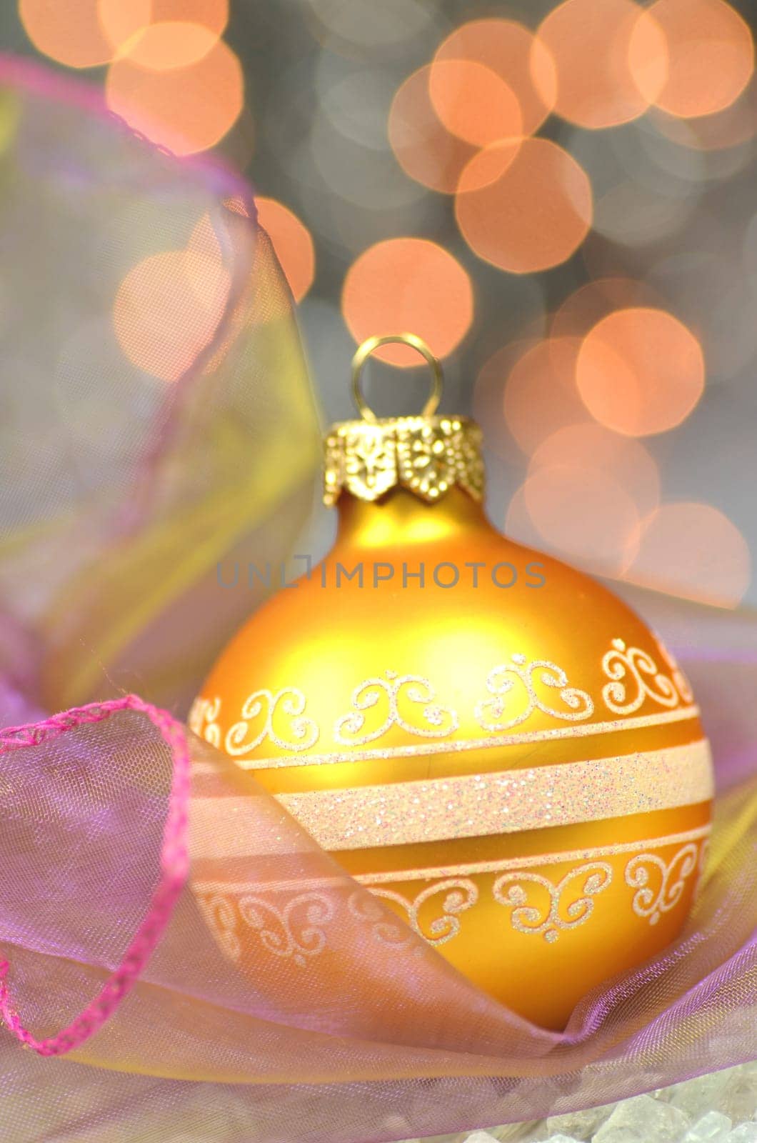 christmas decoration, golden Christmas ball against bokeh background