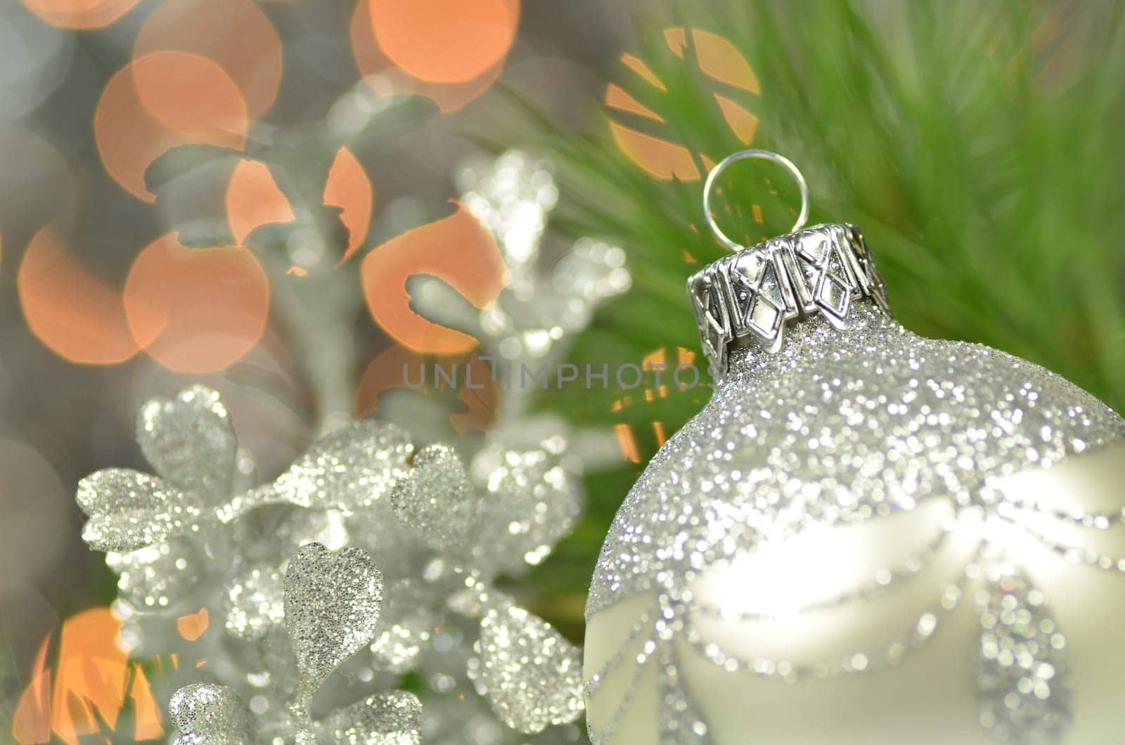 christmas decoration, silver Christmas ball against bokeh background