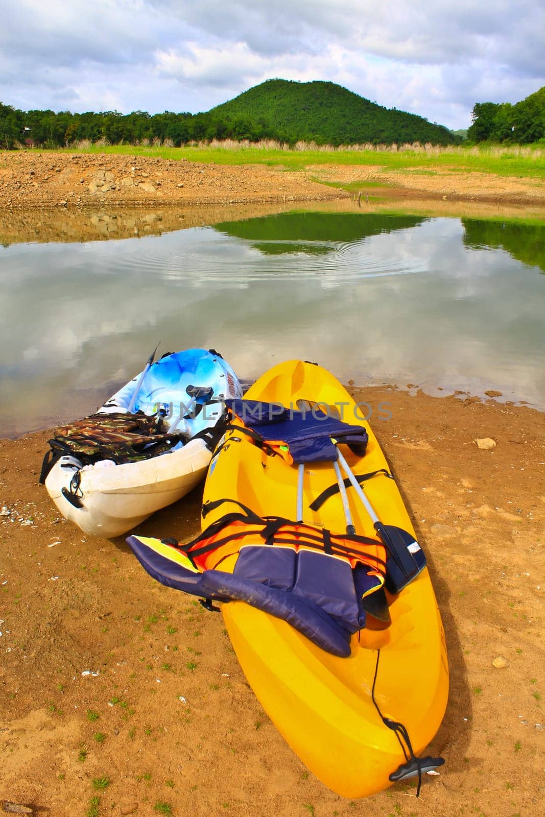 Kayaks, canoe  on the edge of the water in Lake Dam Kaeng Krachan, Thailand