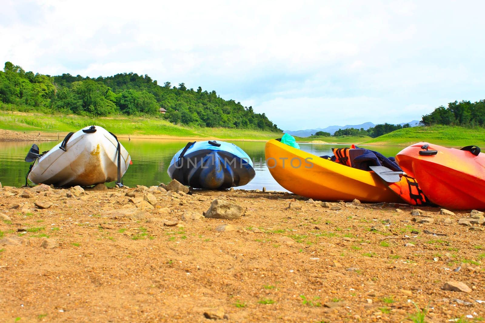 Kayaks, canoe  on the edge of the water in Lake Dam Kaeng Krachan, Thailand