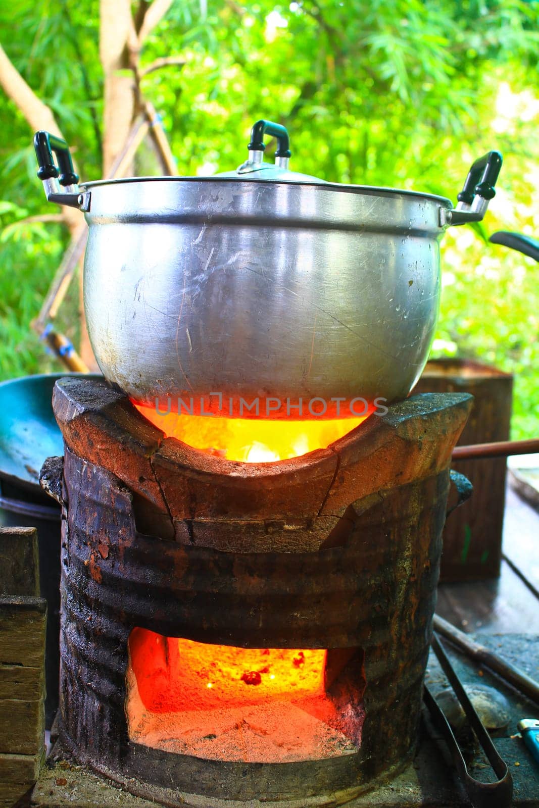 Rice cooker, boiling in the aluminum pot on Stove