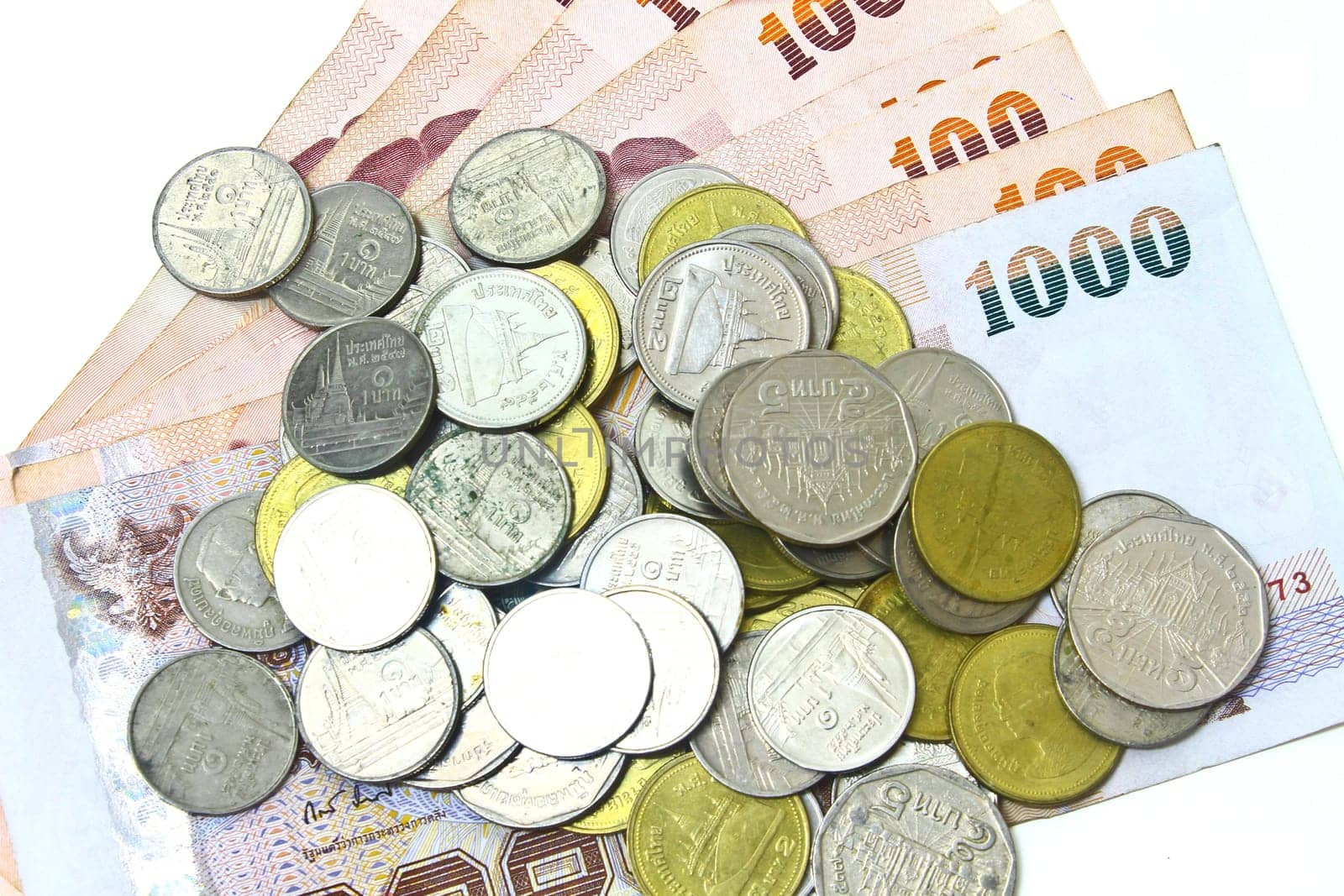 Thailand paper currency and coins isolated on white background