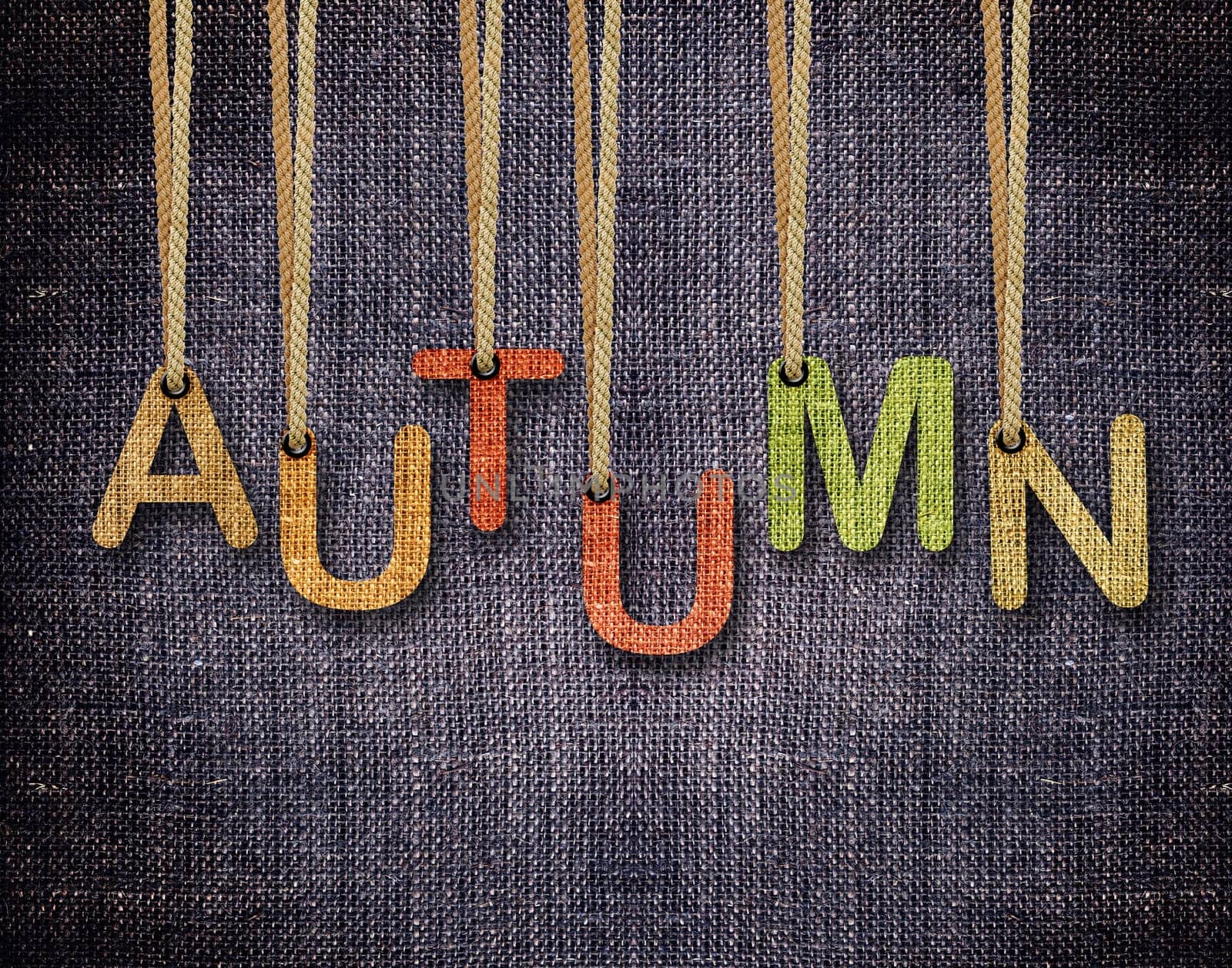 Autumn letters hanging strings with blue sackcloth background.