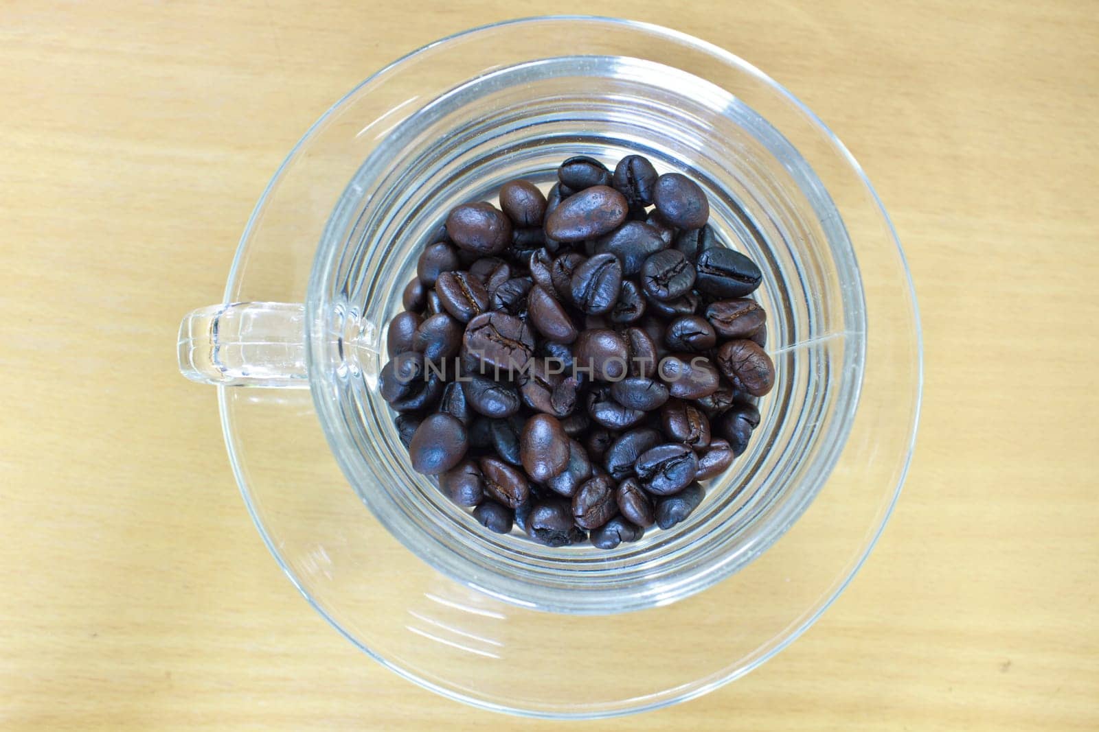 coffee beans in cup on the wood table