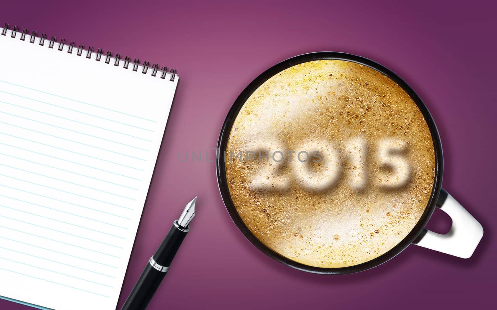 Happy new year 2015, cup of cappuccino with 2015 numbers made from foam with notepad and pen.