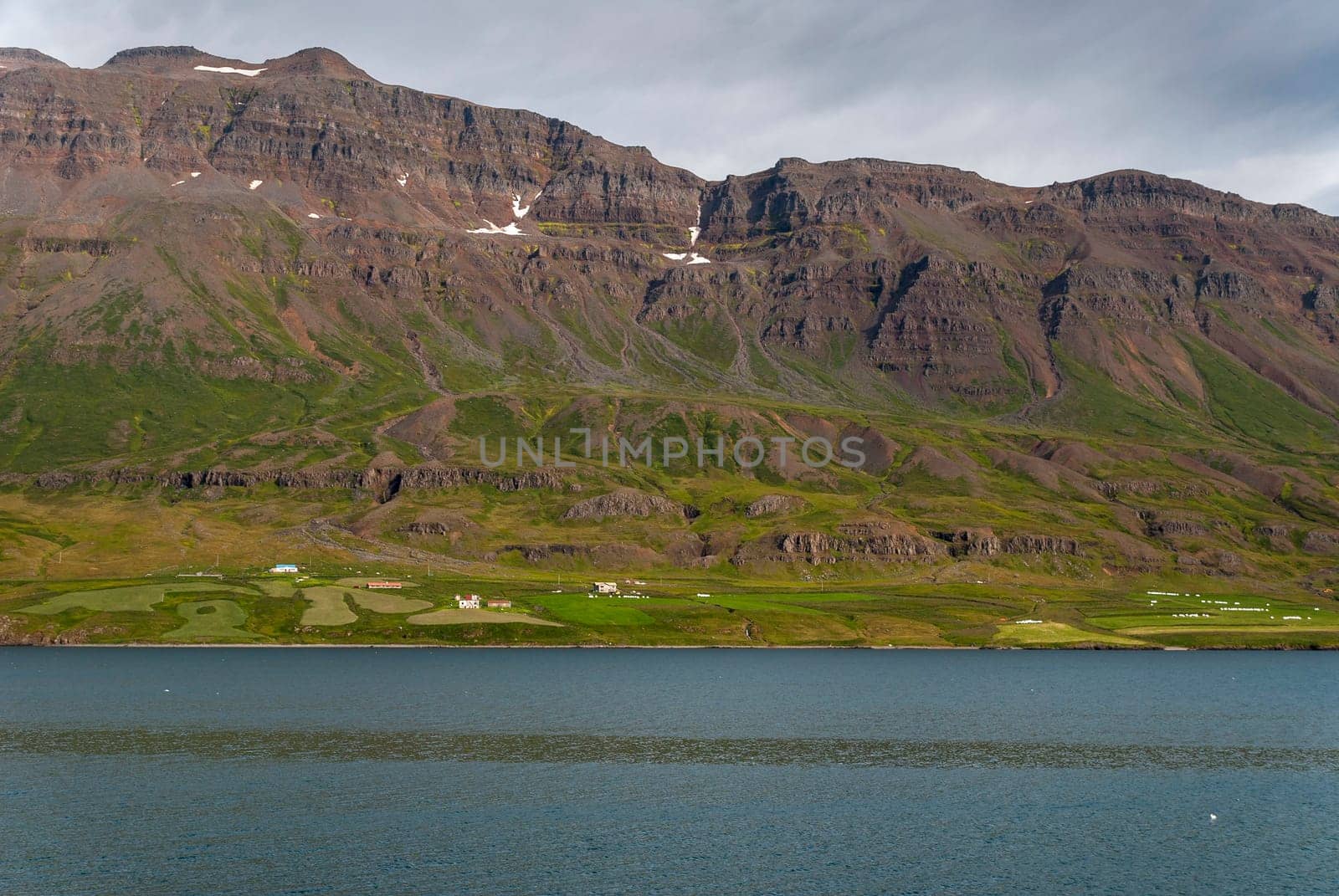 sea sky and meadows in Husavik in Iceland