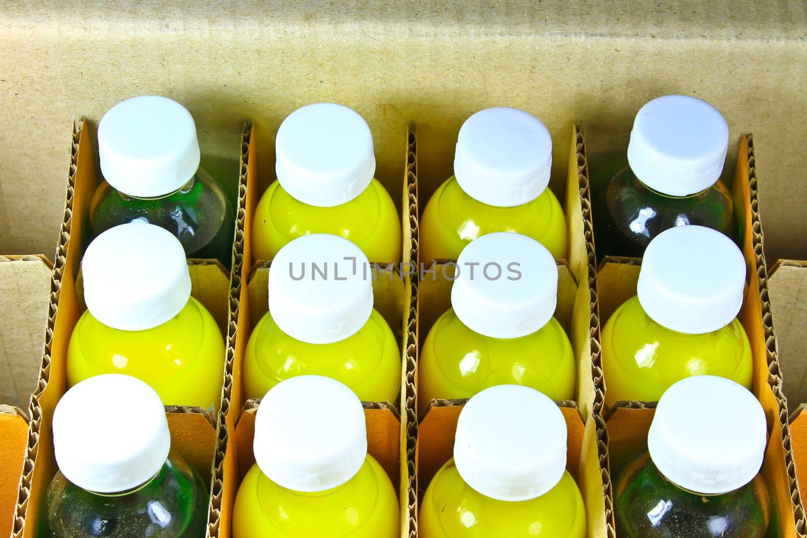 food coloring bottles in a cardboard box