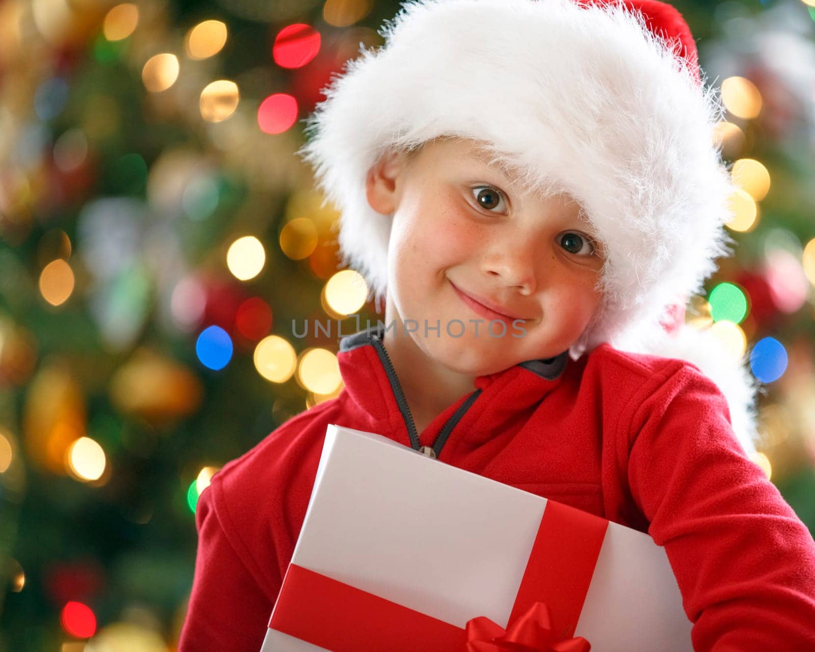 happy boy holding Christmas present