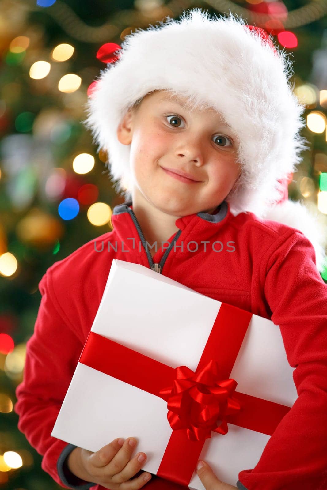 happy boy holding Christmas present