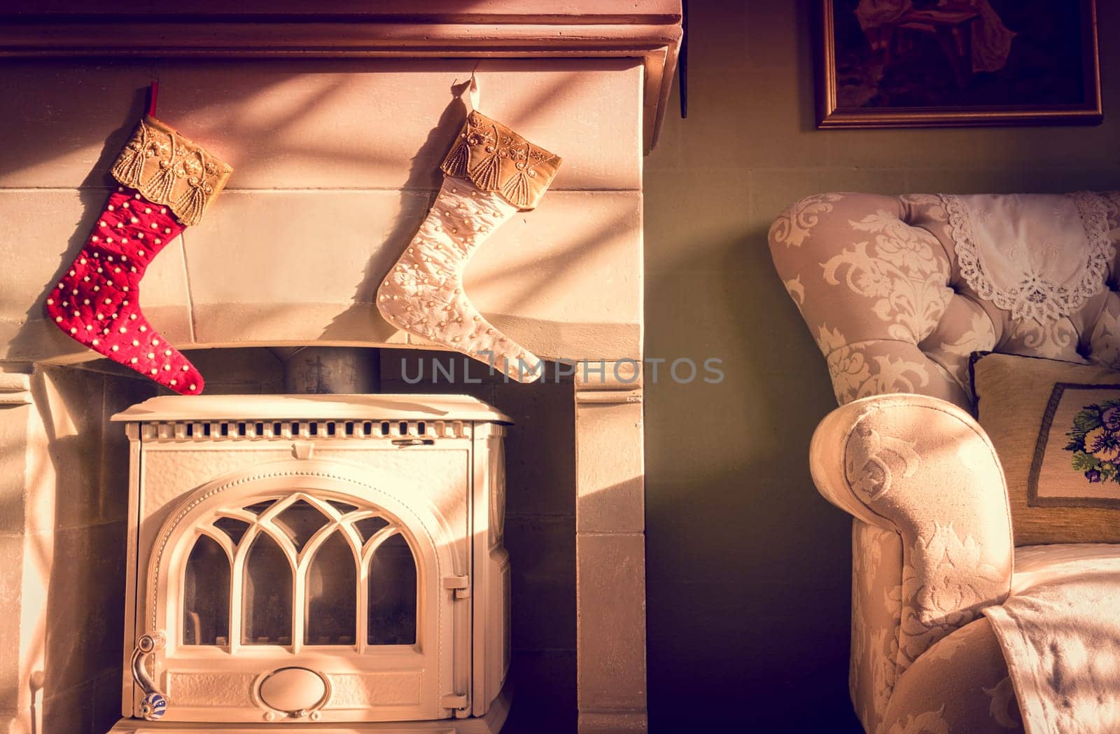 two Christmas stockings hanging above the fireplace