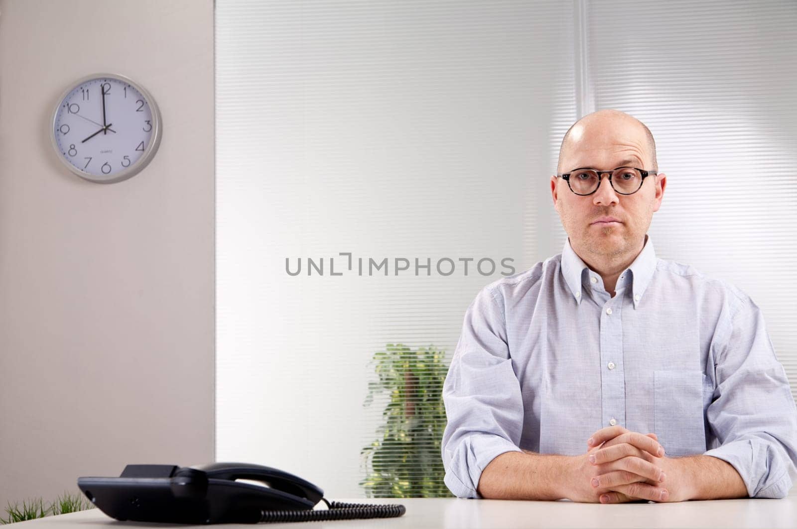 a puzzled senior colleague watching you
