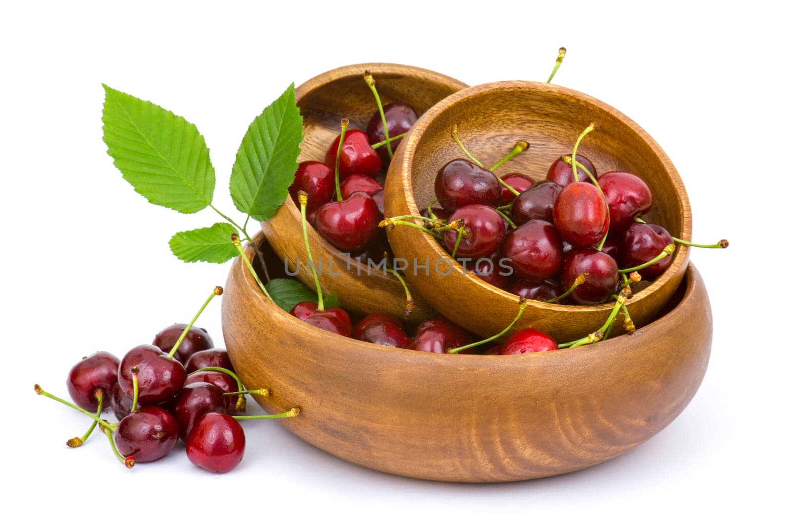fresh cherries in a bowl on white background