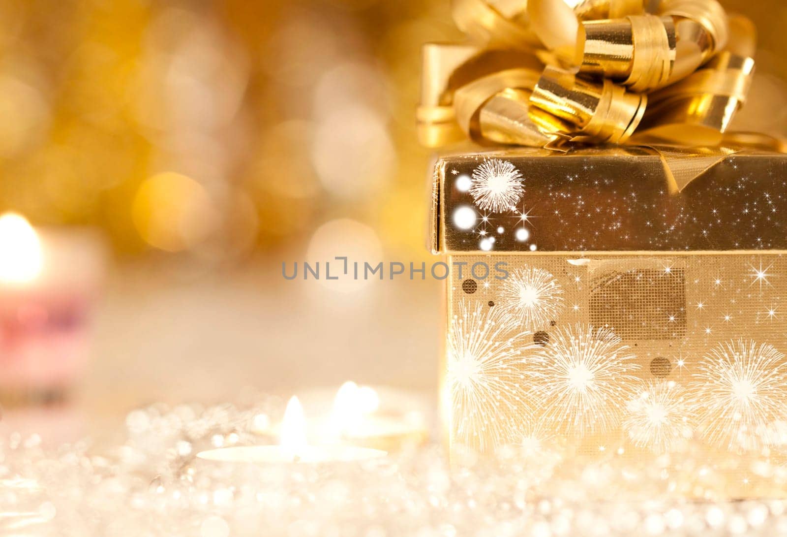 Gift box and candles and holiday lights