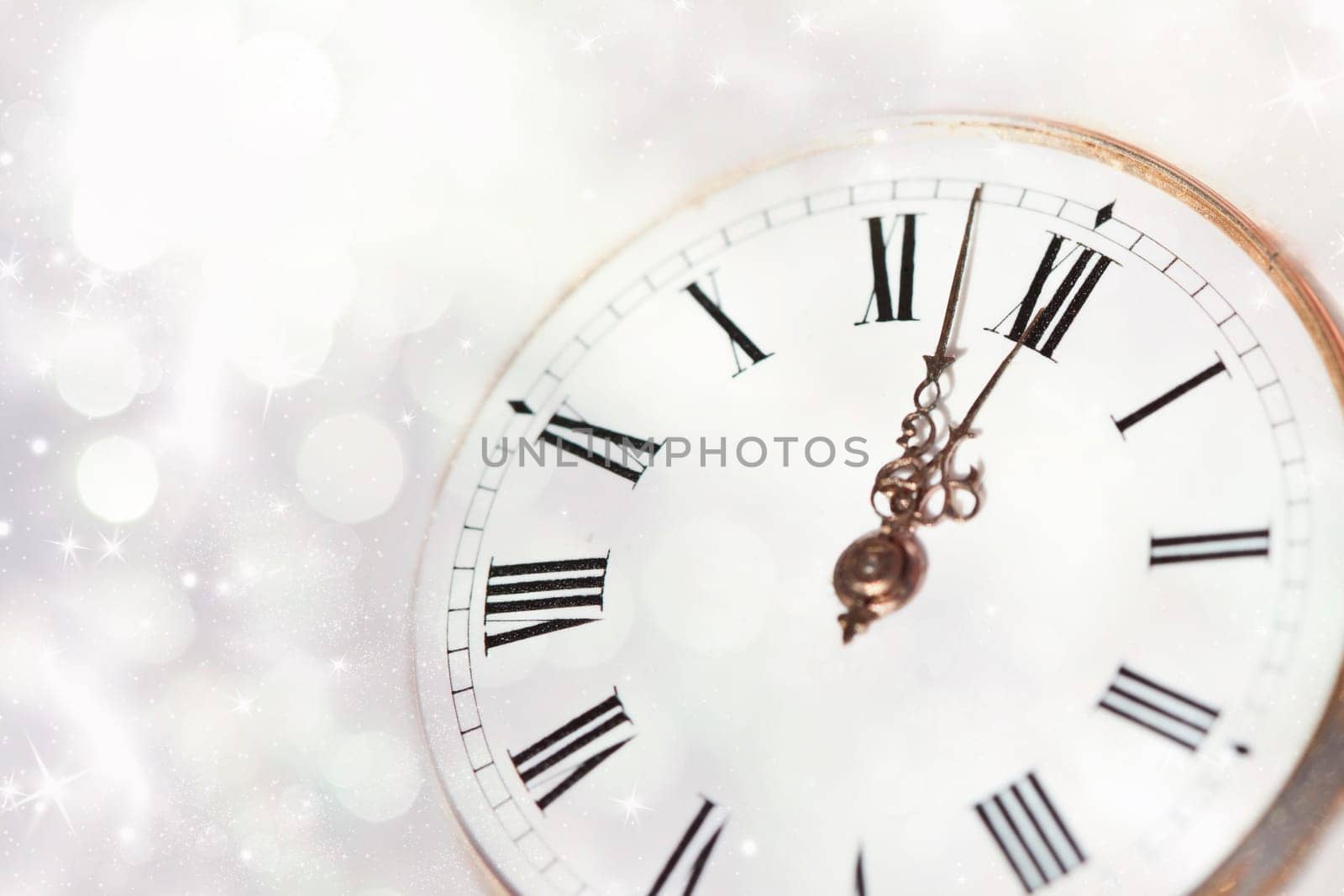 New Year's at midnight - Old clock with stars snowflakes and holiday lights