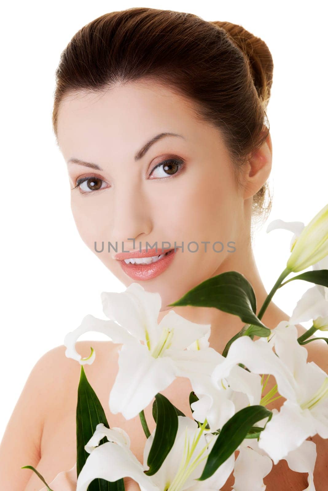 portrait of beautiful adult woman with health skin and lily flower. isolated on white.