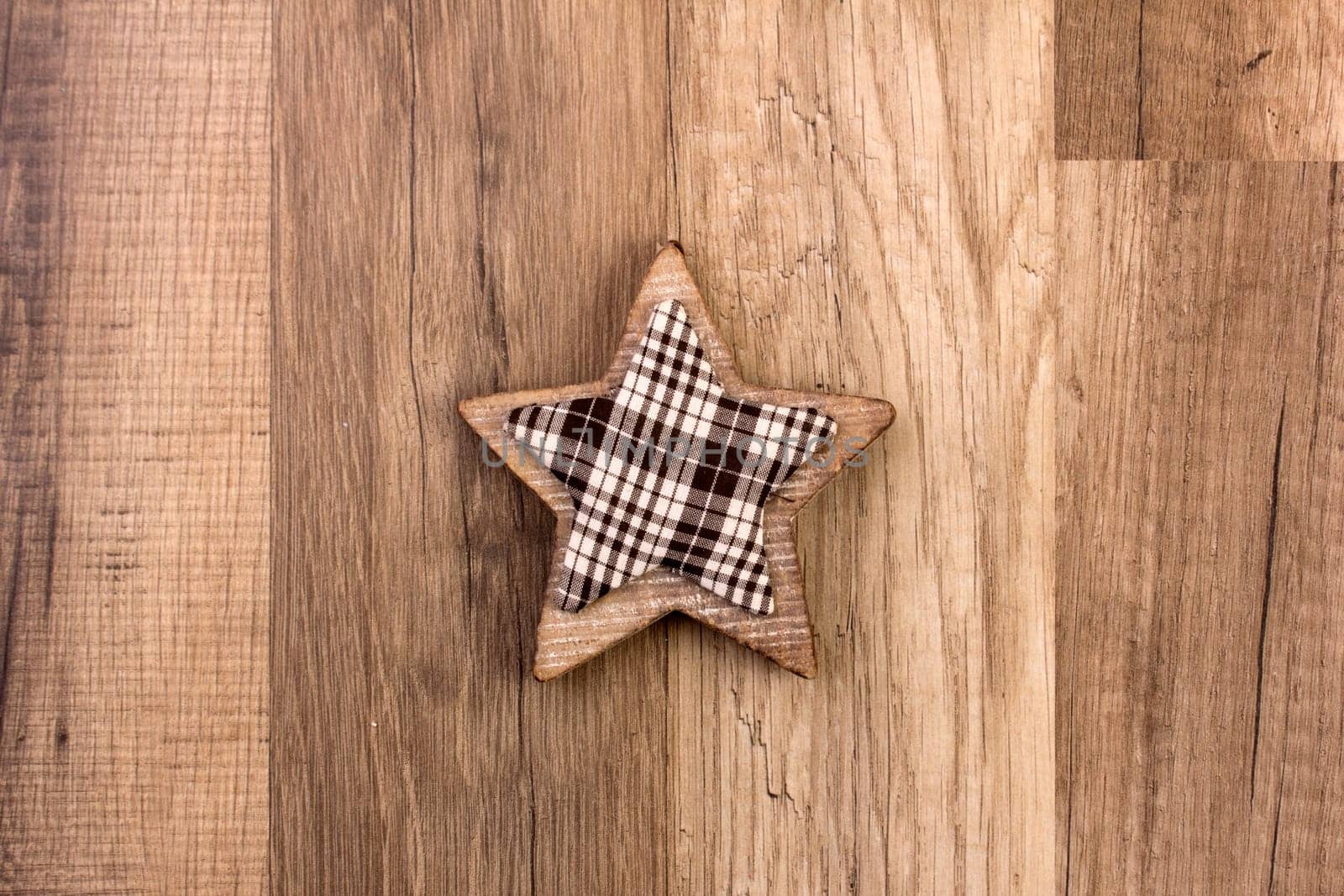 Decoration on wooden background with patterned star