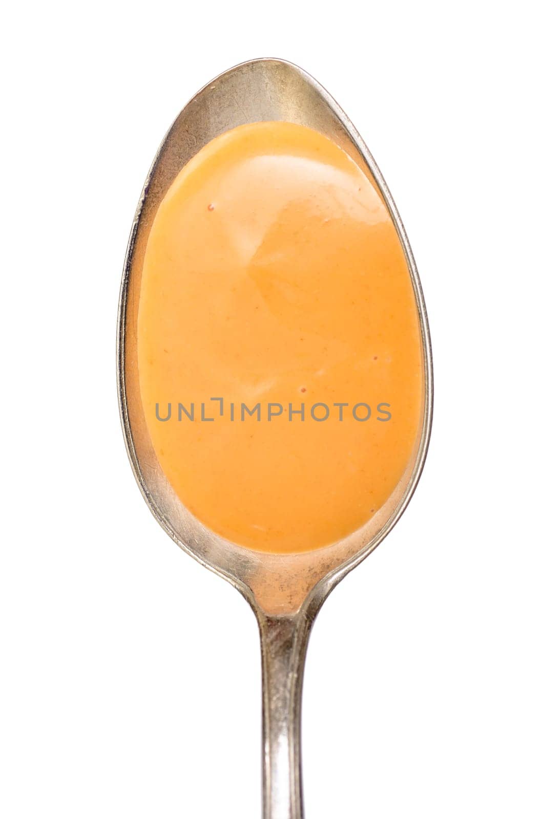 Spoon with cocktail sauce in portrait format and white insulated