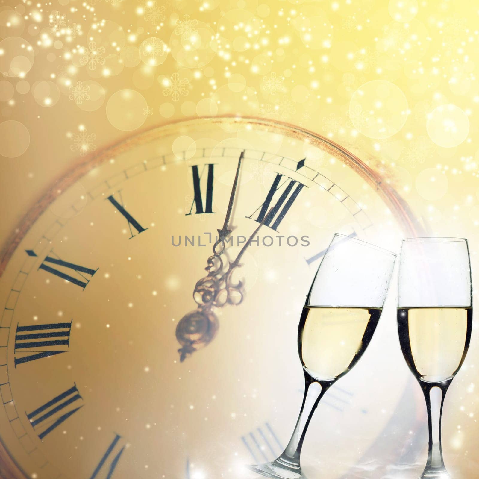 Glasses with champagne against clock and holiday background