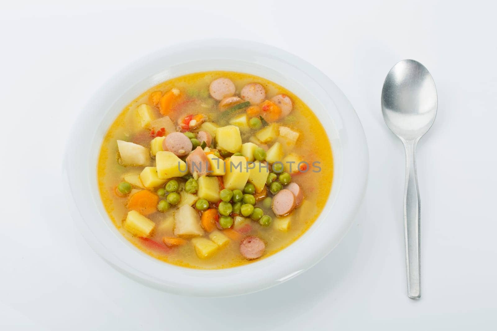 Vegetable soup with sausages