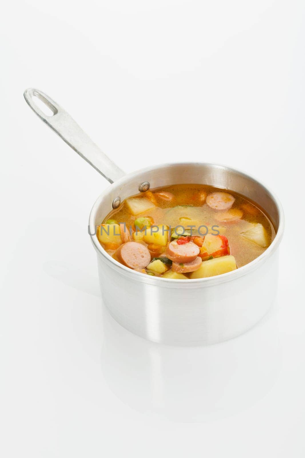Vegetable soup with sausages