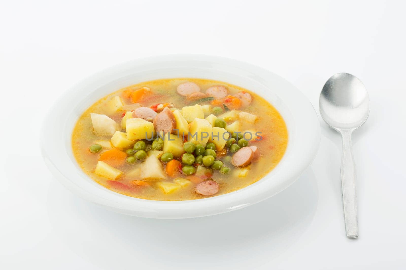 Vegetable soup with sausages