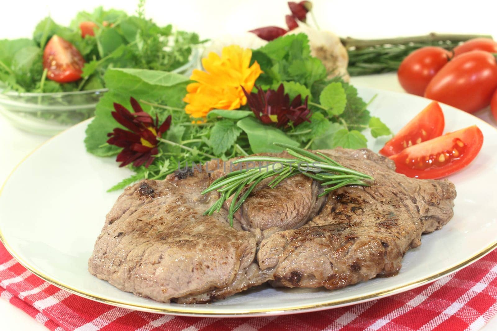 a fried entrecote with wild herb salad