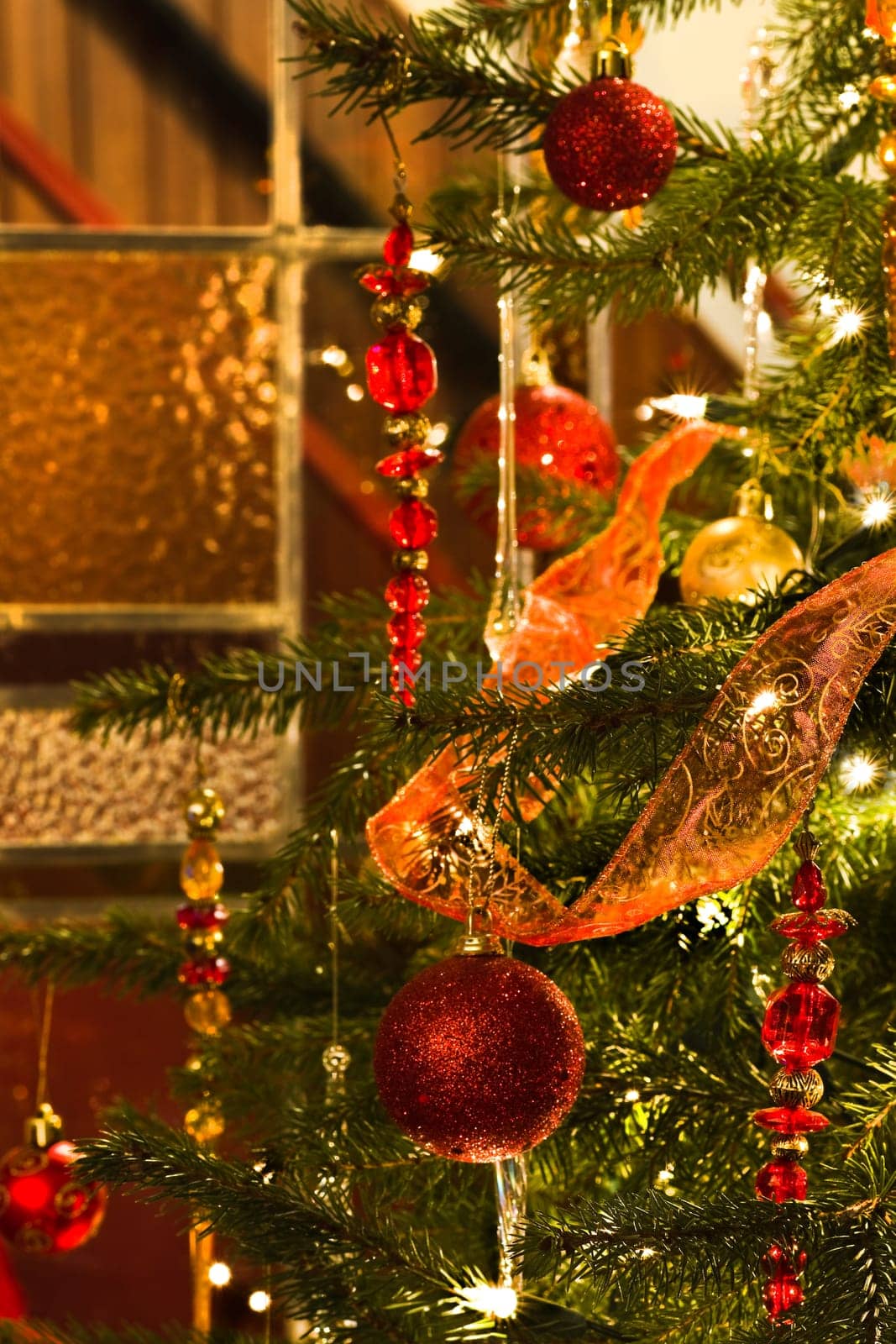 Decorated christmas tree and stained glass window - vertical