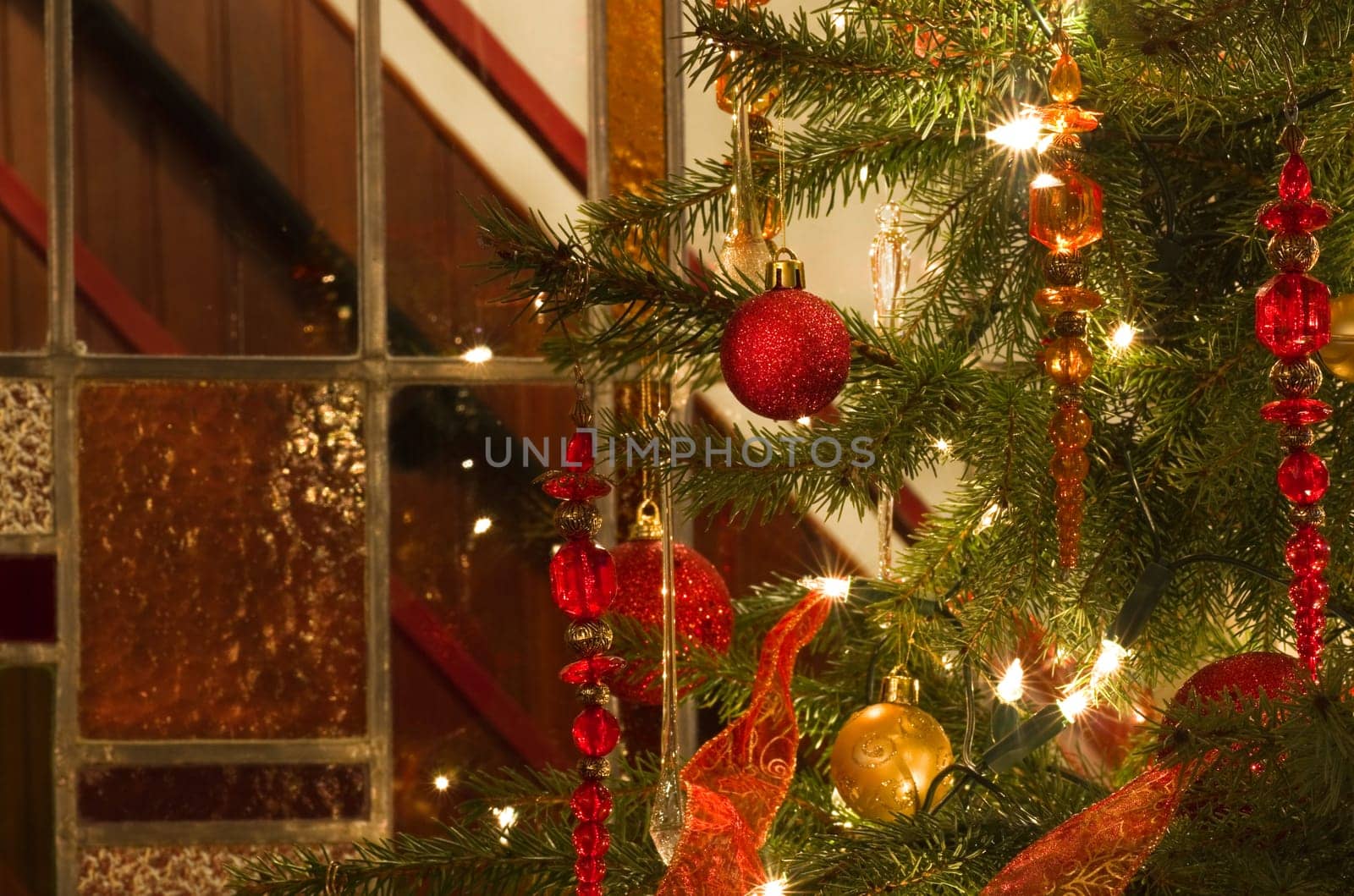 Decorated christmas tree and stained glass window - horizontal