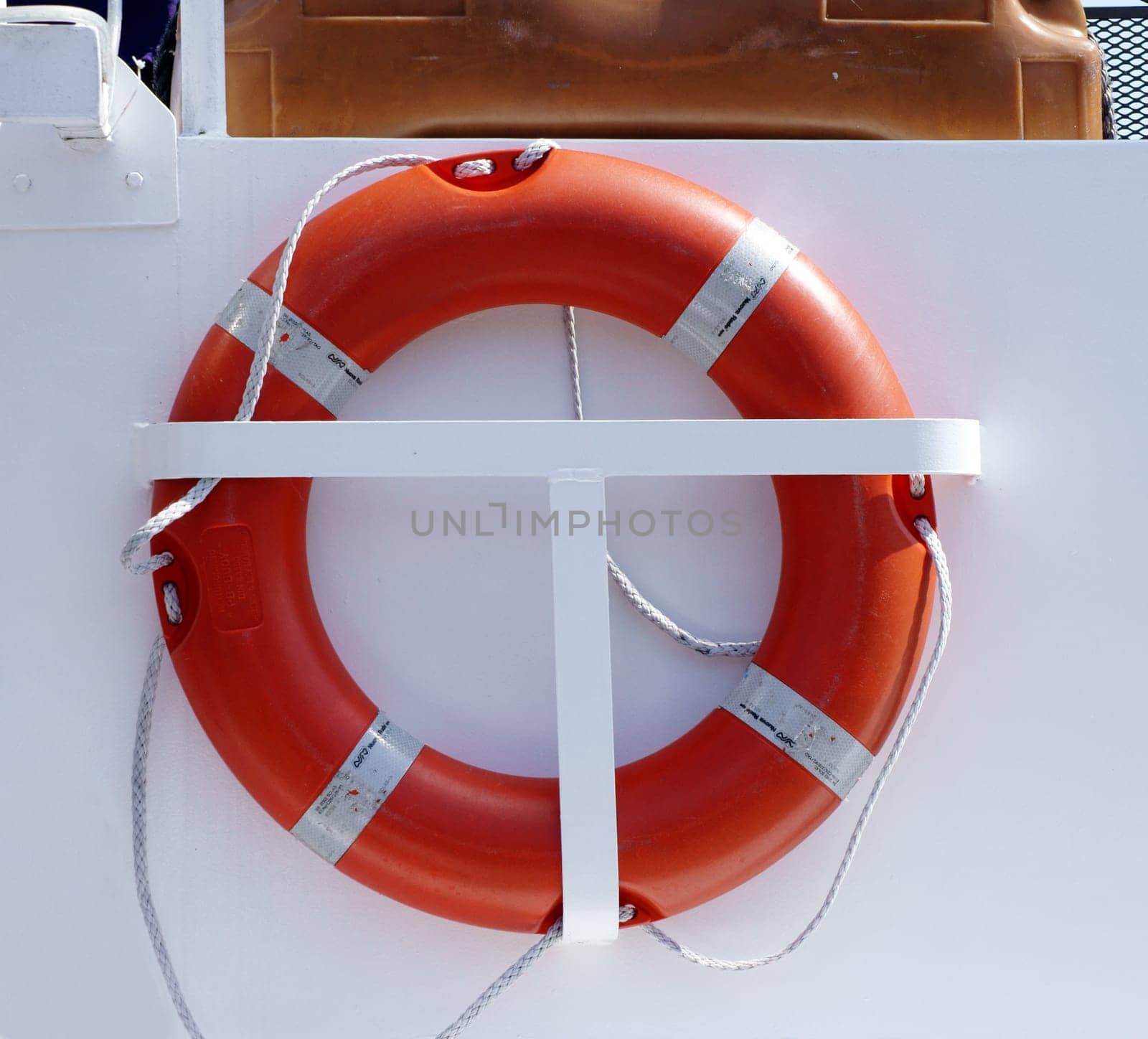 The side view of a passenger ship with a lifebuoy.