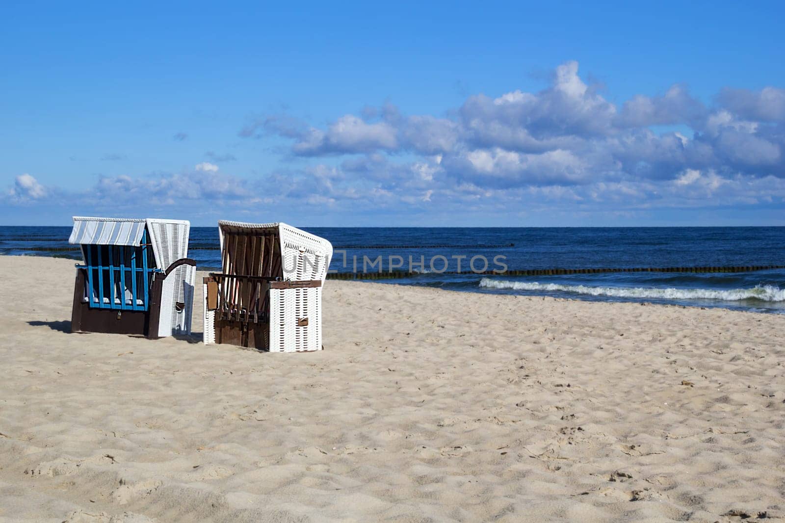 Empty roofed wicker beach chairs at the Usedom beach