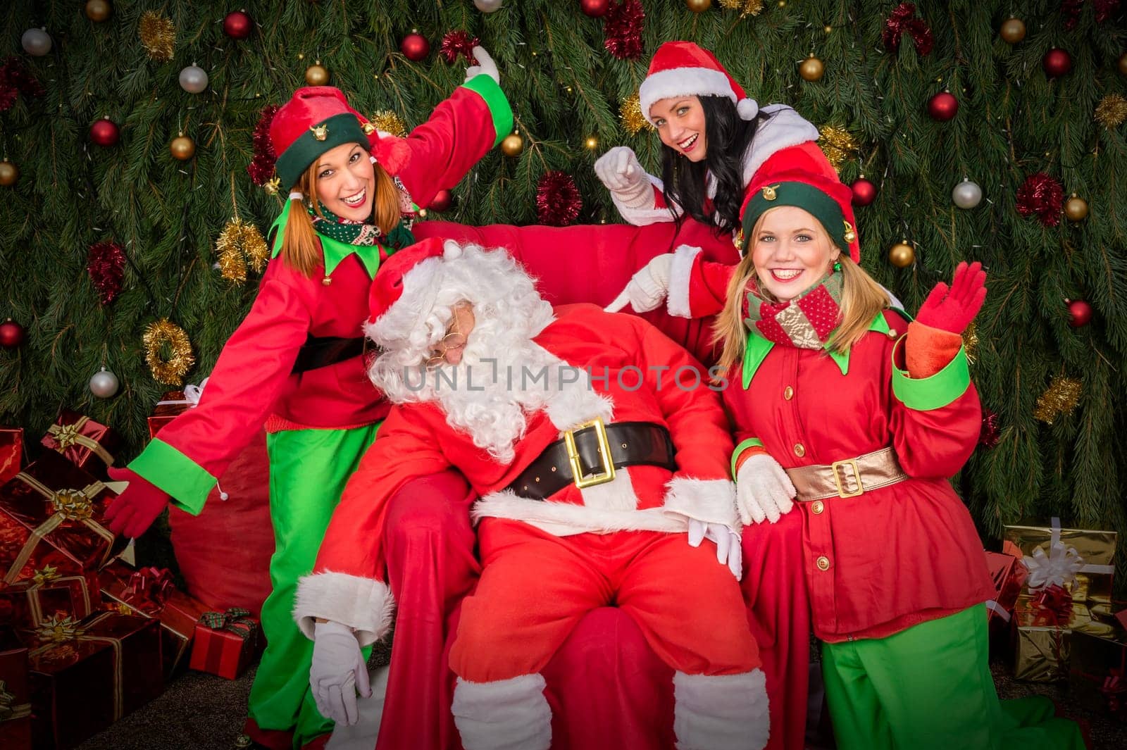 Tired Santa Clause with elf helper sleep chair Christmas decoration