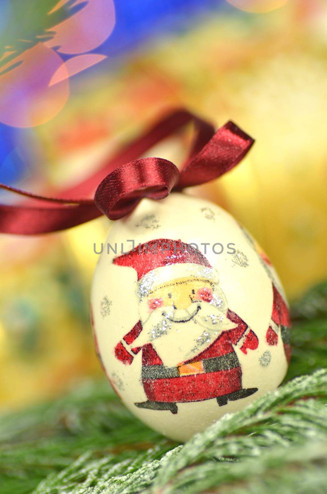 Christmas bauble  made by decoupage technique on bokeh background