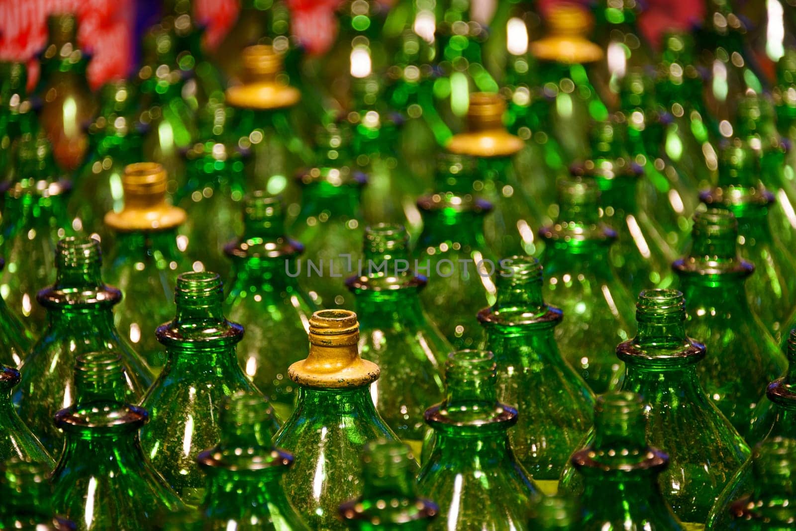 Empty green glass bottles, shallow depth of field