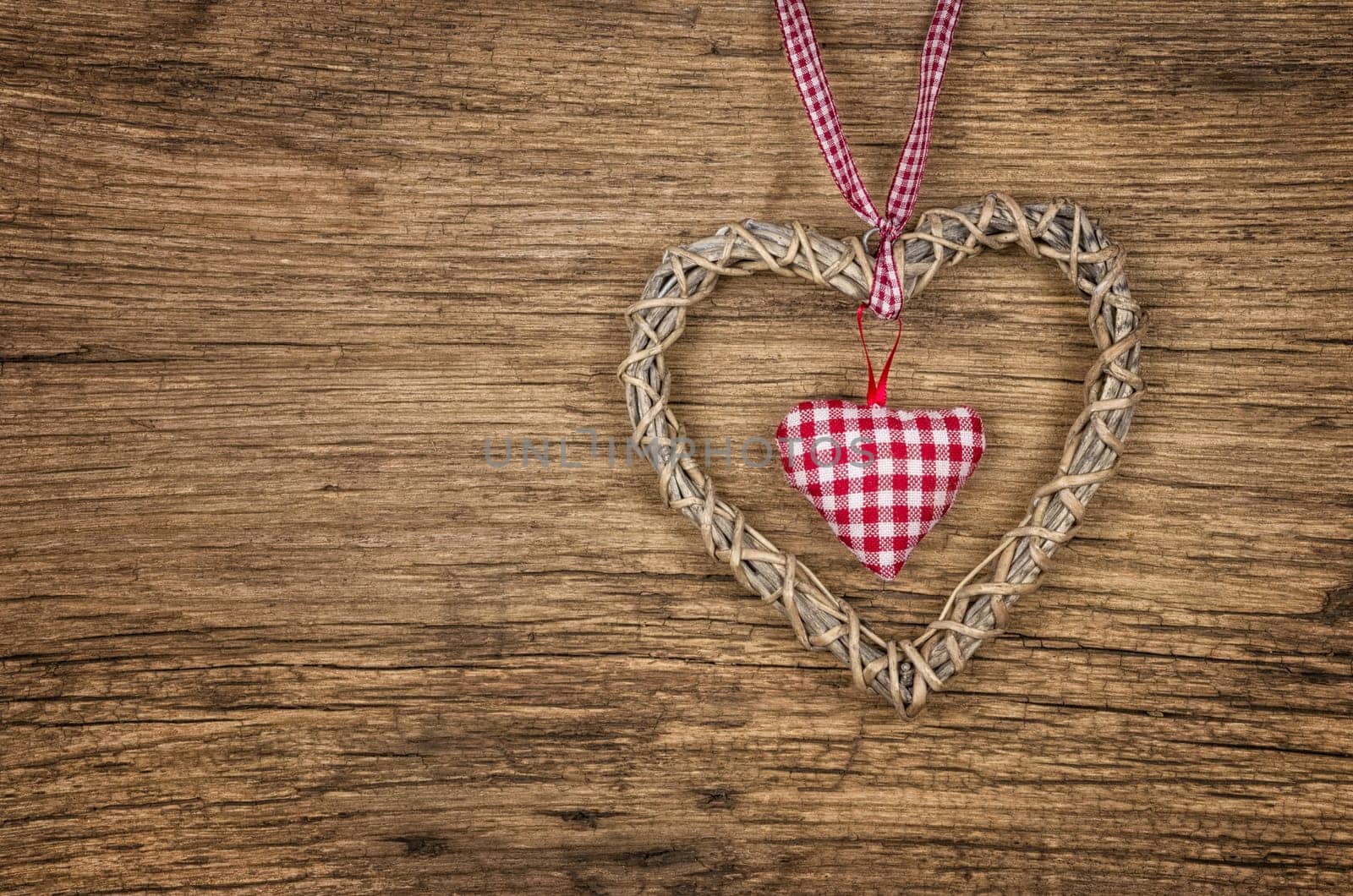 Rustic wooden background with a braided heart